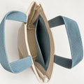 Dune Mini Canvas Tote — interior view showing the side slip pocket, folded rim and bound seams.