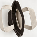 Umber Mini Canvas Tote — interior view showing the side slip pocket, folded rim and bound seams.
