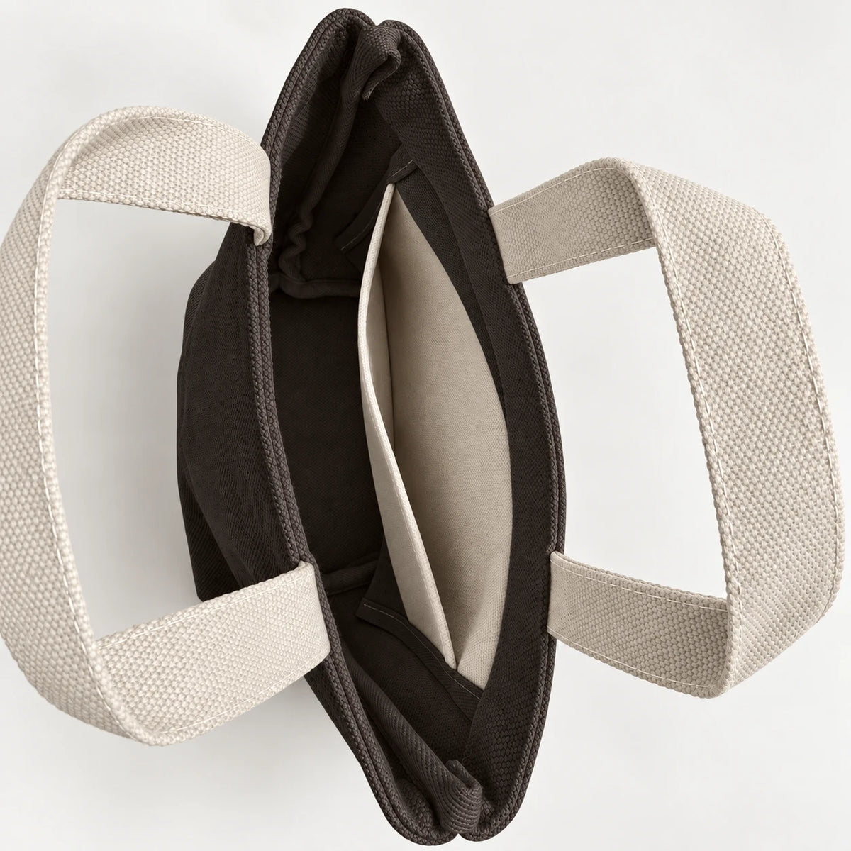 Umber Mini Canvas Tote — interior view showing the side slip pocket, folded rim and bound seams.